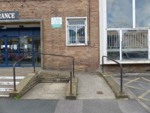 Main Entrance with accessibility ramp for wheelchairs.